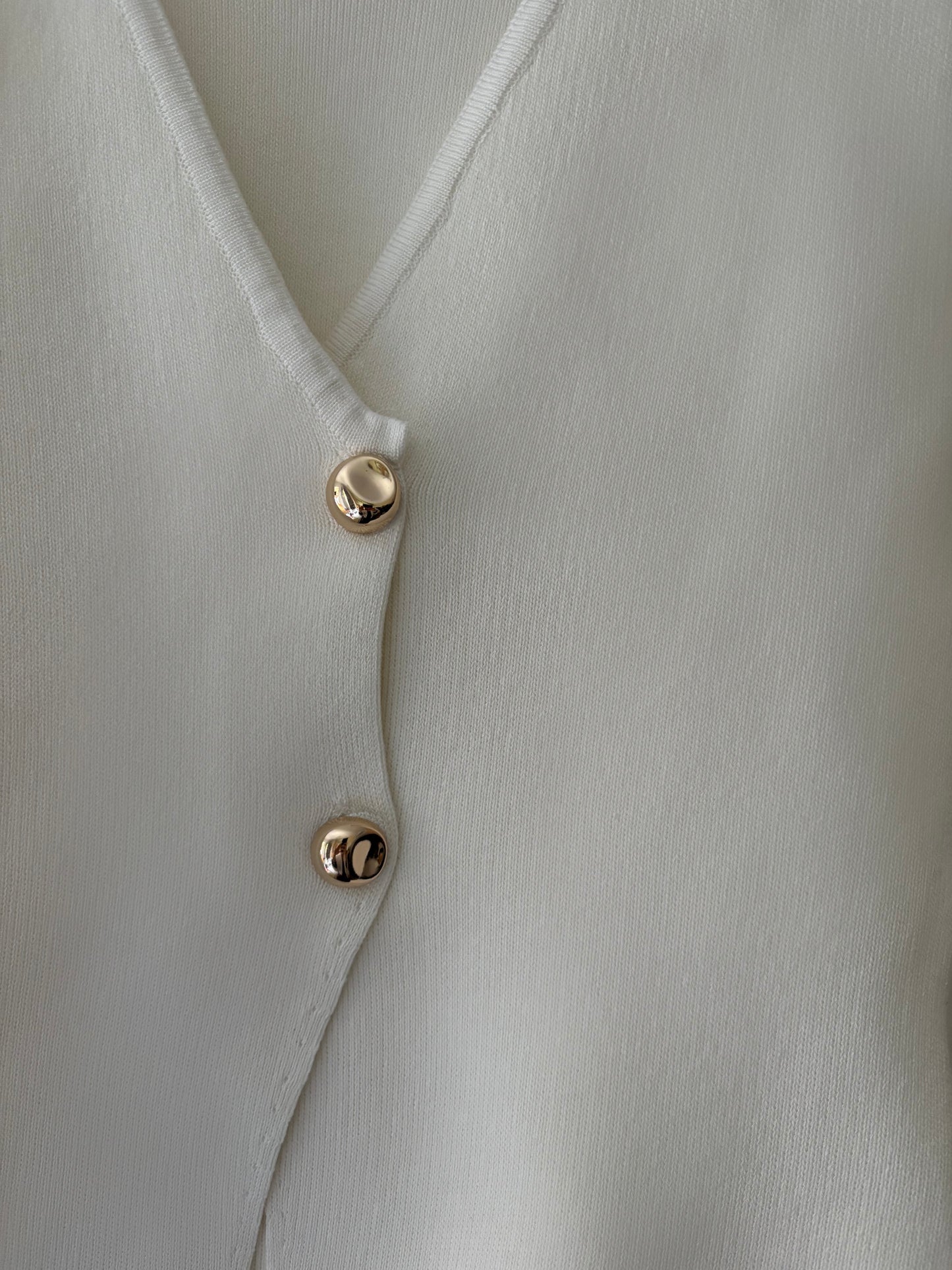 Veston en maille blanc boutons dorés