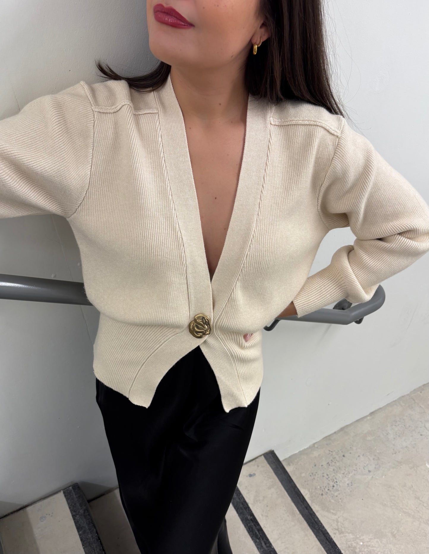 Beige V-neck cardigan with gold button detail