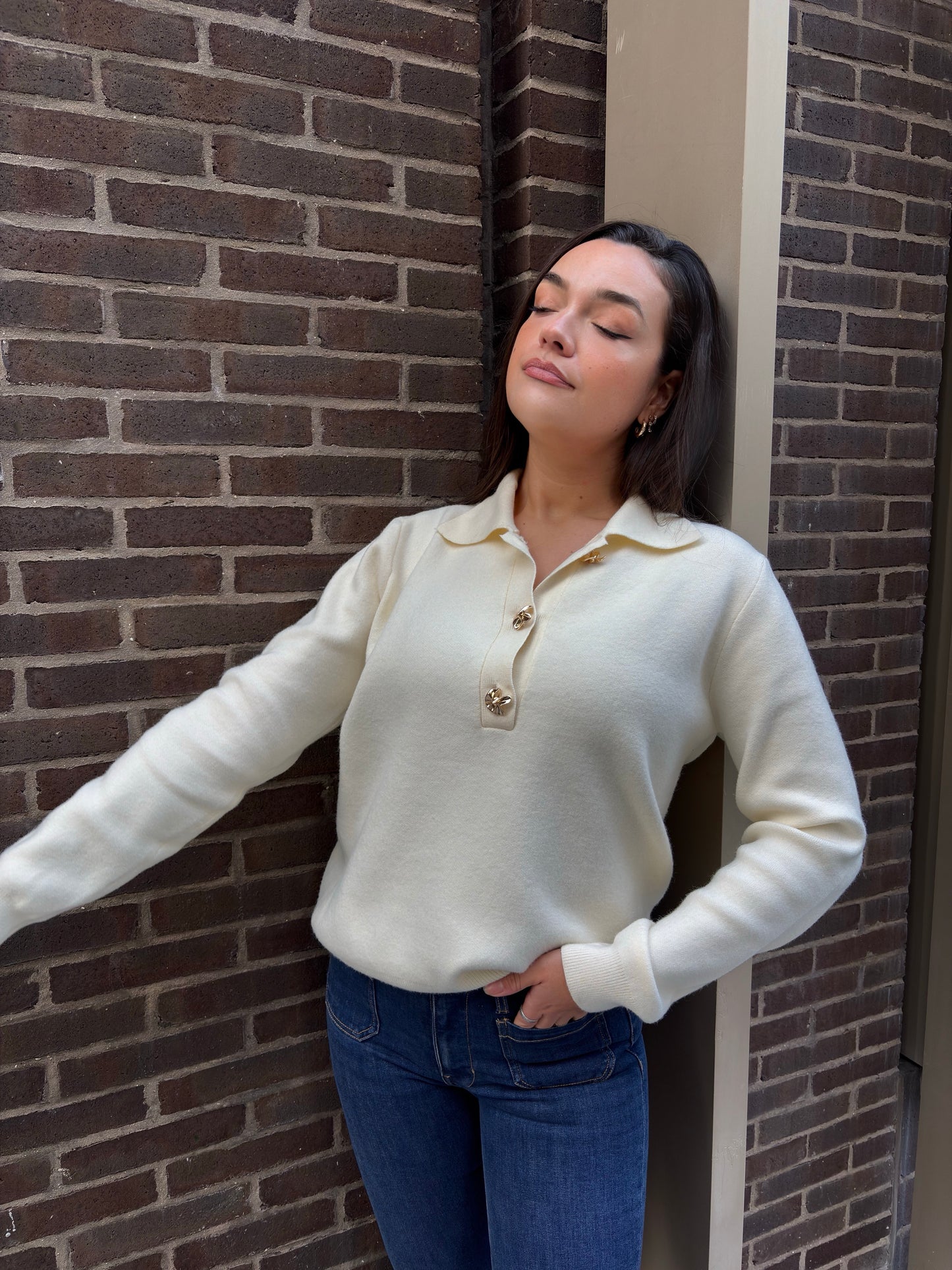 Beige polo neck sweater with gold buttons