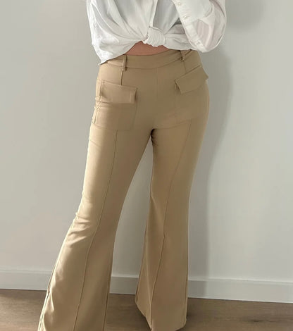 Flared beige pants with visible pockets