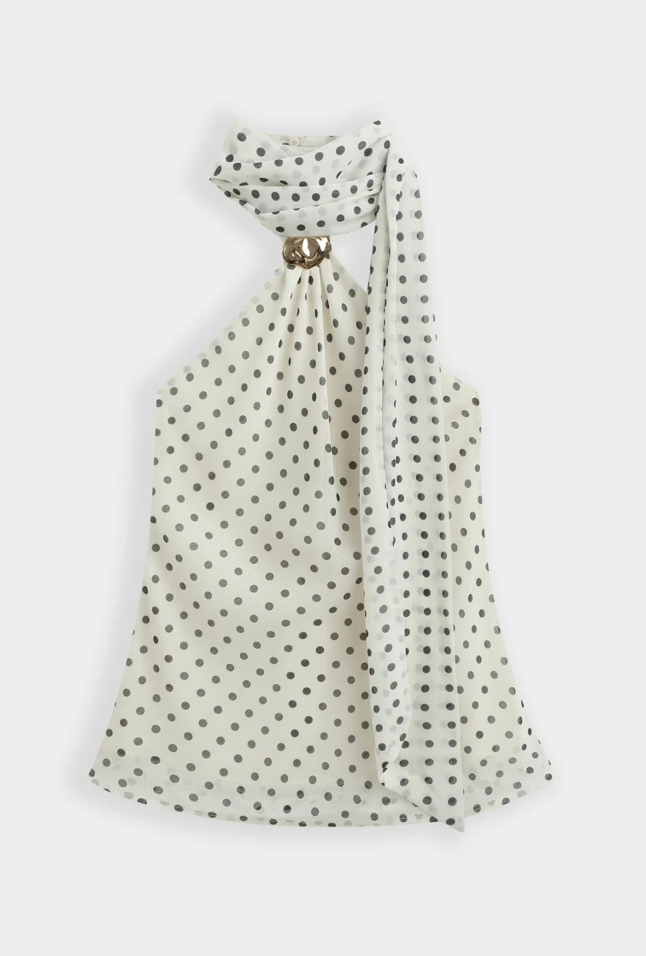 Top ivoire à pois noir col foulard orné d’une broche dorée